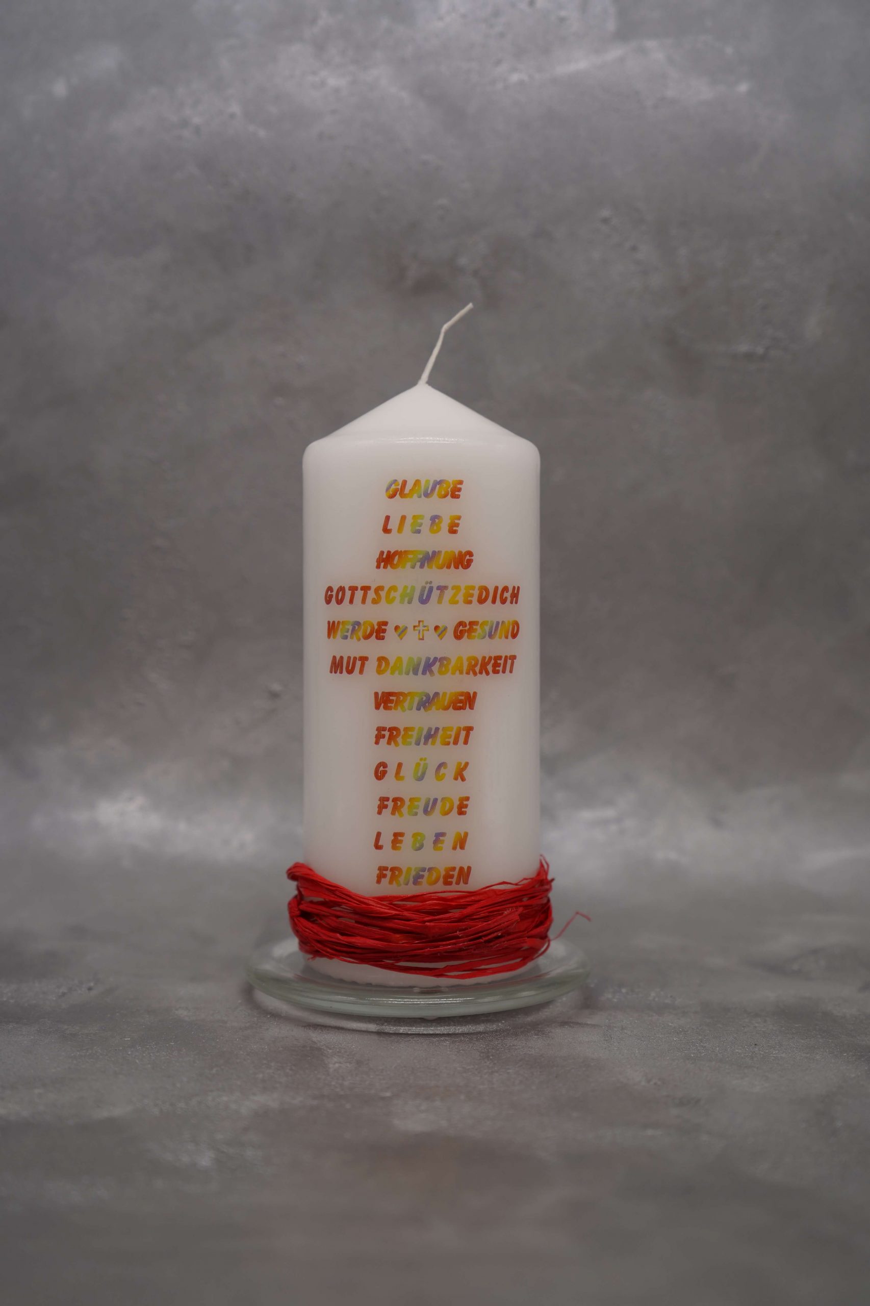 Werdgesund Kerze mit Schriftkreuz und mit drei Symbolen (Kreuz, Herz, Anker)